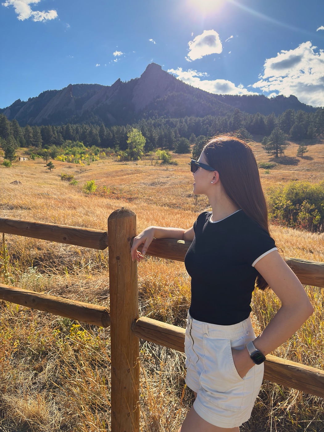 Sofya Durneva at a fence below the Flatirons in Boulder, Colorado.